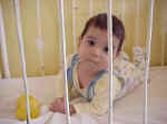 e2 A 0-1 year old in a crib.jpg (22048 bytes)