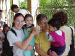 f5 Lydia & Meghan holding kids.jpg (43700 bytes)